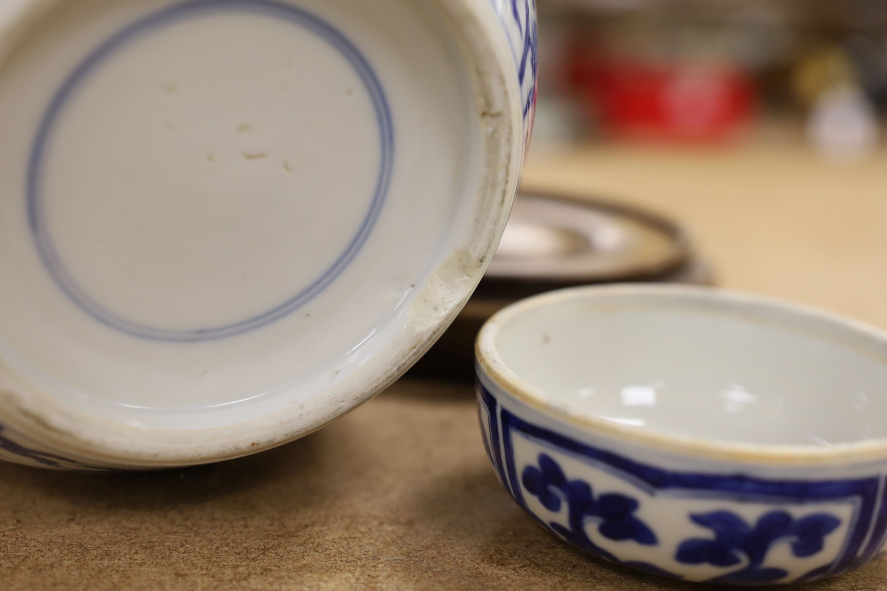A pair of Chinese blue and white ginger jars and covers, 22cm, On stands